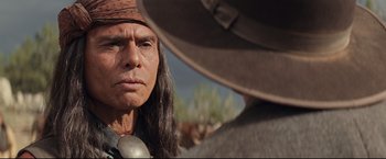 Movie still from “Cowboys & Aliens” (2011), directed by Jon Favreau – A person wearing a hat; Close Up shot, Over the shoulder angle