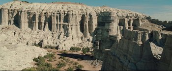 Movie still from “Cowboys & Aliens” (2011), directed by Jon Favreau – A view of a rock formation in the desert from above; Extreme Wide shot, High angle