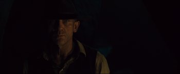 Movie still from “Cowboys & Aliens” (2011), directed by Jon Favreau – A person wearing a hat; Close Up shot, Over the shoulder angle