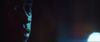 Movie still from “Crash” (2004), directed by Paul Haggis – A man's face in the dark; Extreme Close Up shot, Low angle