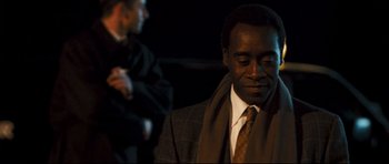 Movie still from “Crash” (2004), directed by Paul Haggis – A man in a suit and a tie; Close Up shot, Over the shoulder angle