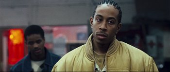 Movie still from “Crash” (2004), directed by Paul Haggis – A person wearing a jacket; Close Up shot, Over the shoulder angle