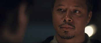 Movie still from “Crash” (2004), directed by Paul Haggis – A man's face in the dark; Close Up shot, Low angle