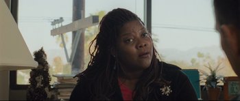 Movie still from “Crash” (2004), directed by Paul Haggis – A person with dreadlocks; Close Up shot, Over the shoulder angle