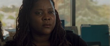 Movie still from “Crash” (2004), directed by Paul Haggis – A person with dreads; Close Up shot, High angle