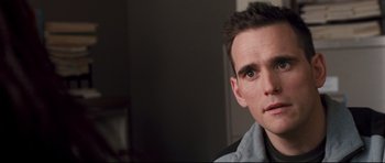 Movie still from “Crash” (2004), directed by Paul Haggis – A person wearing a black shirt; Close Up shot, Over the shoulder angle