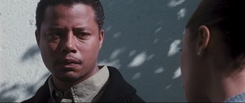 Movie still from “Crash” (2004), directed by Paul Haggis – A person wearing a jacket; Close Up shot, Low angle