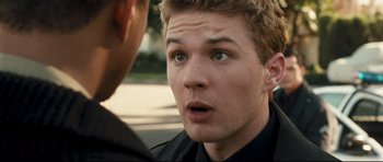 Movie still from “Crash” (2004), directed by Paul Haggis – A person talking to another person; Close Up shot, Over the shoulder angle