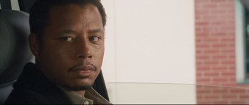 Movie still from “Crash” (2004), directed by Paul Haggis – A man's face in front of a white wall; Close Up shot, Over the shoulder angle