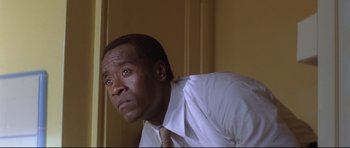 Movie still from “Crash” (2004), directed by Paul Haggis – A person wearing a shirt and a tie; Close Up shot, Low angle