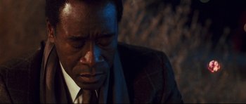 Movie still from “Crash” (2004), directed by Paul Haggis – A person with his eyes closed; Close Up shot, High angle