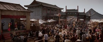 Movie still from “Crouching Tiger, Hidden Dragon” (2000), directed by Ang Lee – A crowd of people standing on top of a dirt road; Extreme Wide shot, High angle