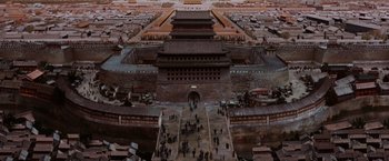 Movie still from “Crouching Tiger, Hidden Dragon” (2000), directed by Ang Lee – An aerial view of an ancient city with people walking around it; Extreme Wide shot, High angle