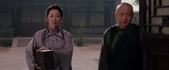 Movie still from “Crouching Tiger, Hidden Dragon” (2000), directed by Ang Lee – A man and a woman standing next to each other; Medium shot, Low angle