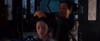 Movie still from “Crouching Tiger, Hidden Dragon” (2000), directed by Ang Lee – A woman getting her hair combed by another woman; Close Up shot, Over the shoulder angle