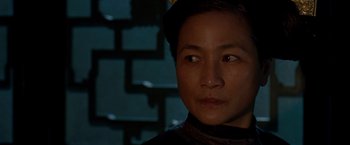 Movie still from “Crouching Tiger, Hidden Dragon” (2000), directed by Ang Lee – A person looking at the camera; Close Up shot, Over the shoulder angle