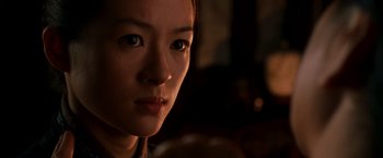 Movie still from “Crouching Tiger, Hidden Dragon” (2000), directed by Ang Lee – A woman's face in the dark; Close Up shot, Over the shoulder angle