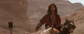 Movie still from “Crouching Tiger, Hidden Dragon” (2000), directed by Ang Lee – A man riding on the back of a white horse; Medium shot, Low angle