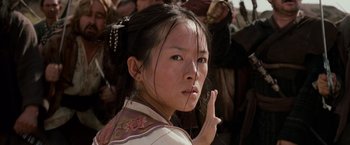 Movie still from “Crouching Tiger, Hidden Dragon” (2000), directed by Ang Lee – A young woman in a traditional chinese dress; Close Up shot, Over the shoulder angle