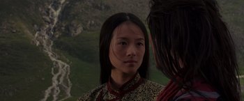 Movie still from “Crouching Tiger, Hidden Dragon” (2000), directed by Ang Lee – A young woman wearing a traditional chinese dress; Close Up shot, Over the shoulder angle
