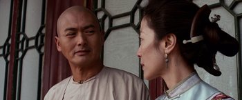 Movie still from “Crouching Tiger, Hidden Dragon” (2000), directed by Ang Lee – A man and a woman standing next to each other; Close Up shot, Over the shoulder angle