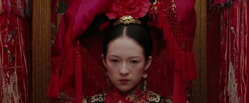 Movie still from “Crouching Tiger, Hidden Dragon” (2000), directed by Ang Lee – A woman in a red dress and a red hat; Close Up shot, Low angle