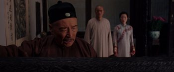 Movie still from “Crouching Tiger, Hidden Dragon” (2000), directed by Ang Lee – A man and two women standing in front of a computer screen; Medium shot, Over the shoulder angle