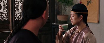 Movie still from “Crouching Tiger, Hidden Dragon” (2000), directed by Ang Lee – A man and a woman are drinking tea together; Medium shot, Over the shoulder angle
