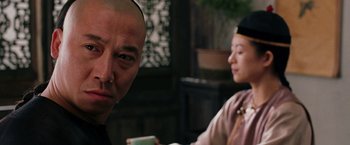Movie still from “Crouching Tiger, Hidden Dragon” (2000), directed by Ang Lee – A man and a woman are drinking coffee; Close Up shot, Over the shoulder angle