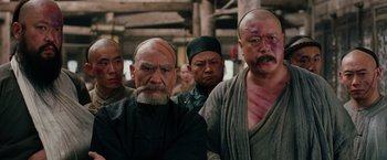 Movie still from “Crouching Tiger, Hidden Dragon” (2000), directed by Ang Lee – A group of men standing next to each other; Close Up shot, Low angle