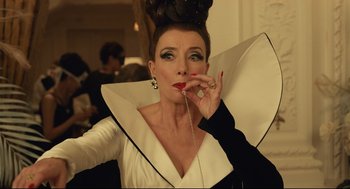 Movie still from “Cruella” (2021), directed by Craig Gillespie – A person wearing a costume; Close Up shot, Overhead angle