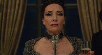 Movie still from “Cruella” (2021), directed by Craig Gillespie – A person wearing a necklace; Close Up shot, Low angle