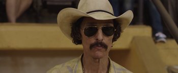 Movie still from “Dallas Buyers Club” (2013), directed by Jean-Marc Vallée – A person wearing a hat and sunglasses; Close Up shot, Low angle