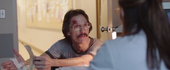 Movie still from “Dallas Buyers Club” (2013), directed by Jean-Marc Vallée – A man with a bandage on his head and a bandage on his face; Close Up shot, Over the shoulder angle