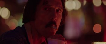Movie still from “Dallas Buyers Club” (2013), directed by Jean-Marc Vallée – A man smoking a cigarette while holding a drink; Close Up shot, Low angle