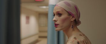 Movie still from “Dallas Buyers Club” (2013), directed by Jean-Marc Vallée – A woman with a head scarf on looking into the distance; Close Up shot, Over the shoulder angle