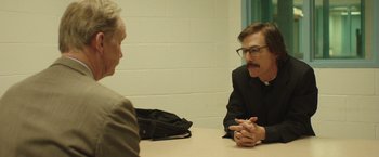 Movie still from “Dallas Buyers Club” (2013), directed by Jean-Marc Vallée – A man and a woman sitting at a table talking to each other; Medium shot, Over the shoulder angle