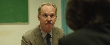 Movie still from “Dallas Buyers Club” (2013), directed by Jean-Marc Vallée – An older man in a suit looking at a mirror; Close Up shot, Over the shoulder angle