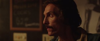Movie still from “Dallas Buyers Club” (2013), directed by Jean-Marc Vallée – A person with a mustache; Close Up shot, Over the shoulder angle