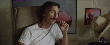 Movie still from “Dallas Buyers Club” (2013), directed by Jean-Marc Vallée – A person sitting in a chair; Close Up shot, Low angle