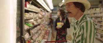 Movie still from “Dallas Buyers Club” (2013), directed by Jean-Marc Vallée – A man in a cowboy hat is shopping in a grocery store; Close Up shot, Over the shoulder angle