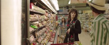 Movie still from “Dallas Buyers Club” (2013), directed by Jean-Marc Vallée – A woman is shopping in a grocery store; Medium shot, Over the shoulder angle