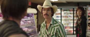 Movie still from “Dallas Buyers Club” (2013), directed by Jean-Marc Vallée – A man with a mustache wearing a cowboy hat; Close Up shot, Over the shoulder angle