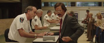 Movie still from “Dallas Buyers Club” (2013), directed by Jean-Marc Vallée – A group of men sitting at a table with papers; Medium shot, Low angle