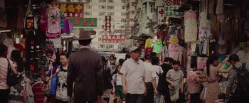 Movie still from “Dallas Buyers Club” (2013), directed by Jean-Marc Vallée – A crowd of people walking down a street; Wide shot, High angle