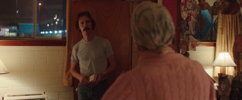 Movie still from “Dallas Buyers Club” (2013), directed by Jean-Marc Vallée – A man standing in front of a mirror in a room; Medium shot, Over the shoulder angle