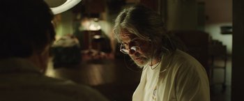 Movie still from “Dallas Buyers Club” (2013), directed by Jean-Marc Vallée – An older man with long grey hair wearing glasses; Close Up shot, Low angle