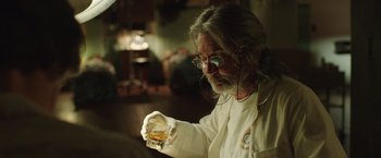 Movie still from “Dallas Buyers Club” (2013), directed by Jean-Marc Vallée – An older man holding a glass of whiskey; Close Up shot, Over the shoulder angle