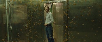 Movie still from “Dallas Buyers Club” (2013), directed by Jean-Marc Vallée – A man standing in front of a metal door; Medium shot, Low angle