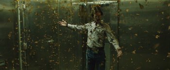 Movie still from “Dallas Buyers Club” (2013), directed by Jean-Marc Vallée – A man standing in front of a metal door; Medium shot, Low angle